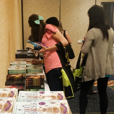 Teens loading up in the Swag Room at the Teen Day Party.